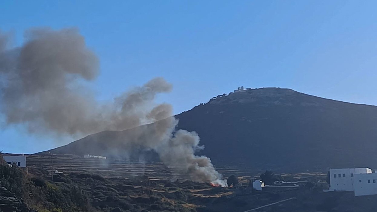 Smoke billows on hilltop