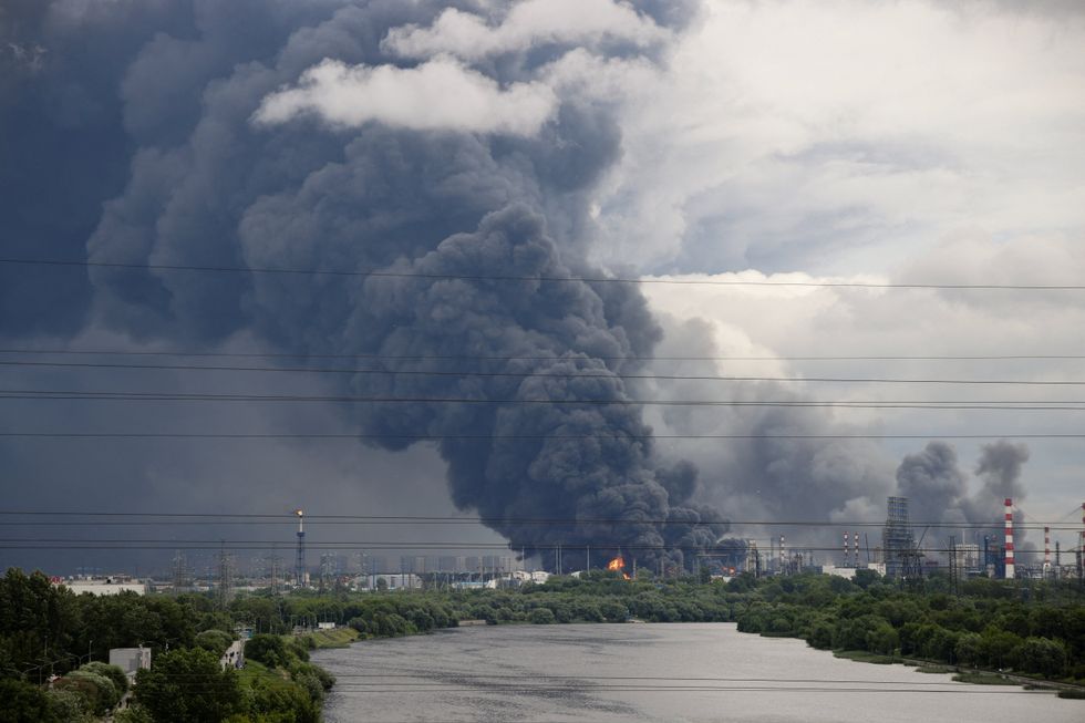 Smoke rises above Moscow Oil Refinery