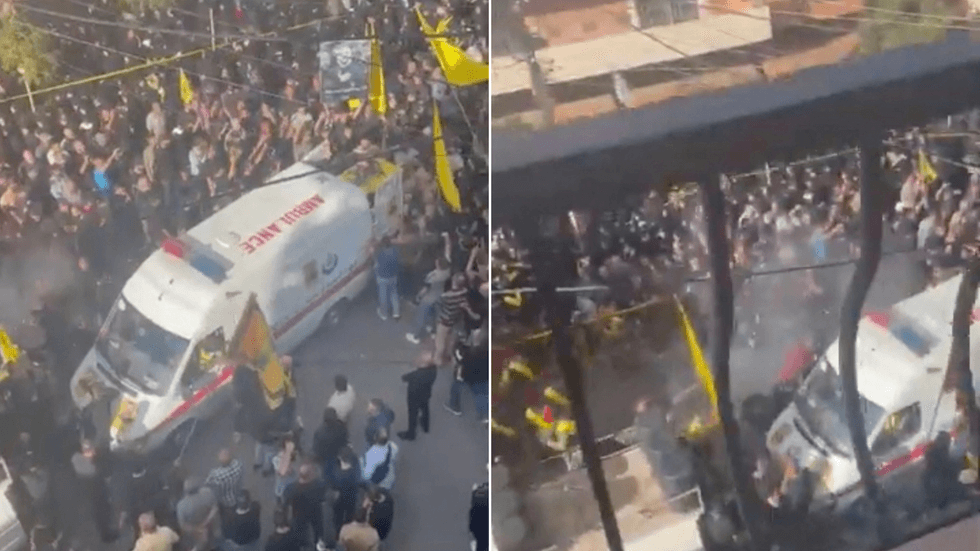 Smoke rises from an explosion during a funeral, coinciding with a second day of devices used by Hezbollah members detonating