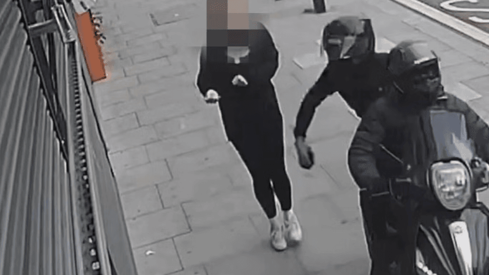 Someone having their phone stolen