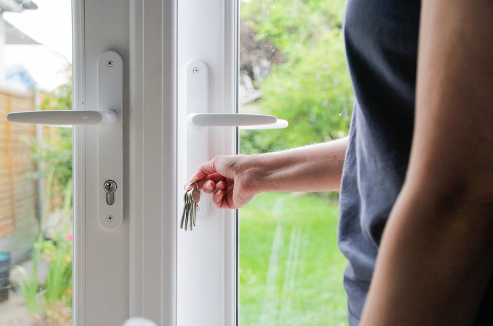 Someone locking a door