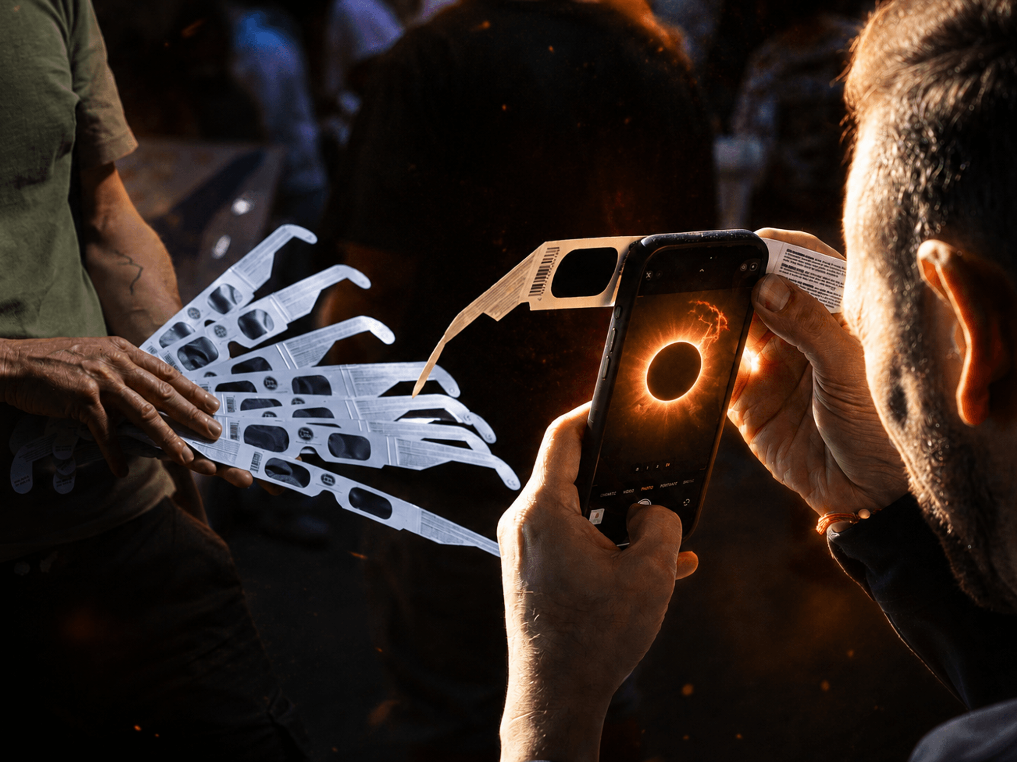 someone points their smartphone camera at the sun