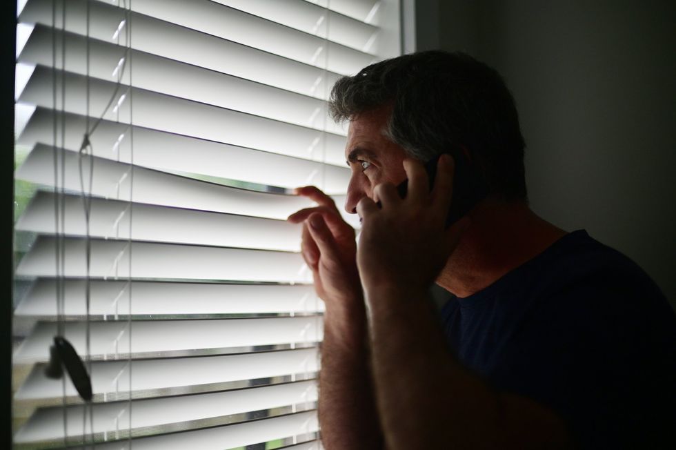 Spying neighbour