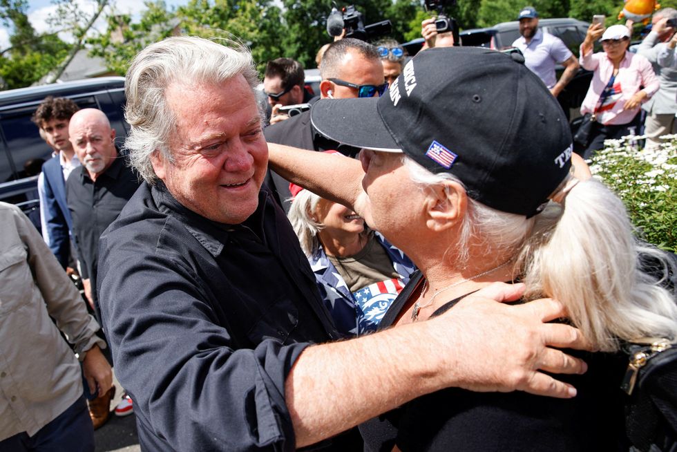 Steven Bannon hugging a supporter