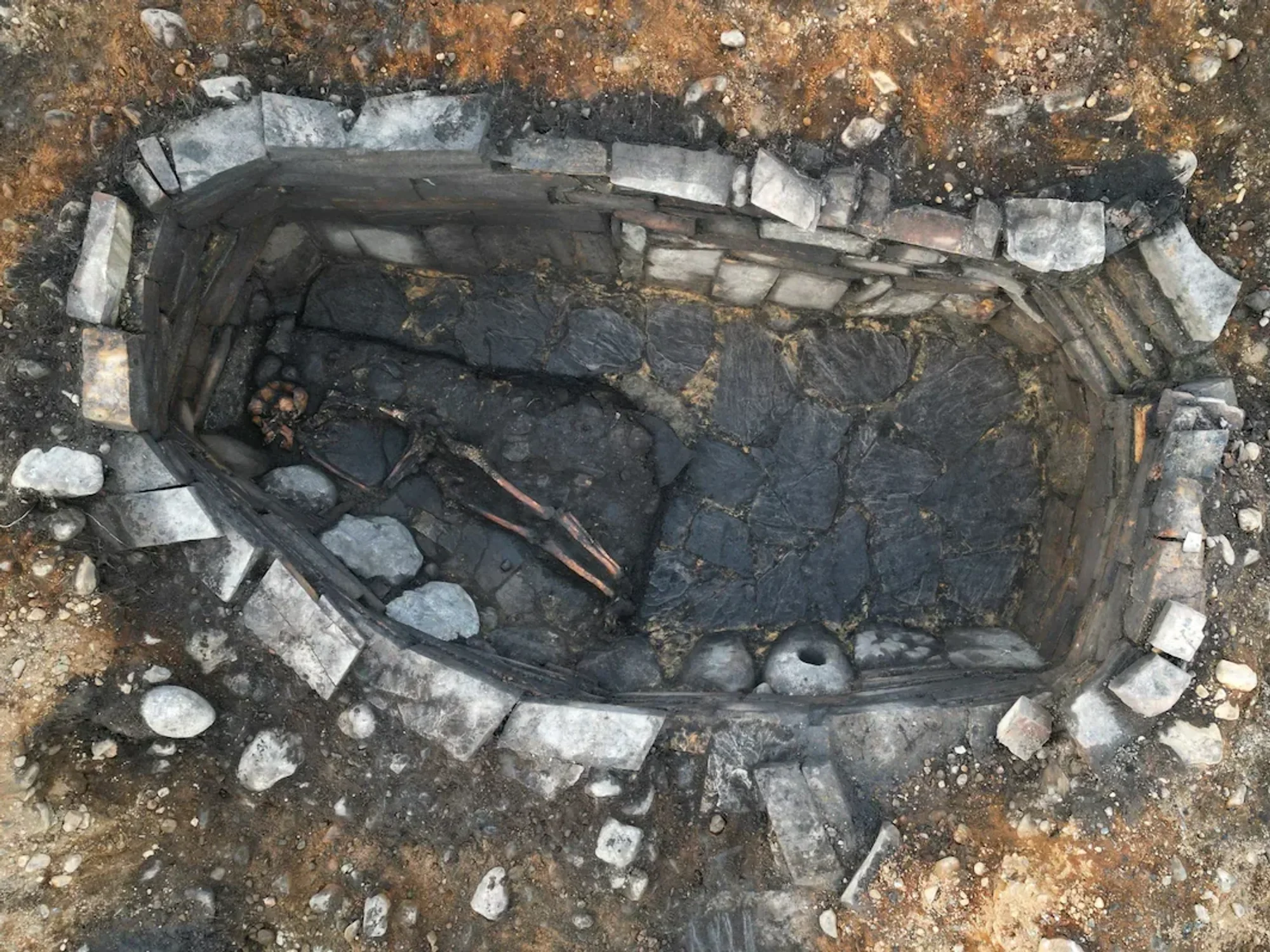 Stone-lined pit