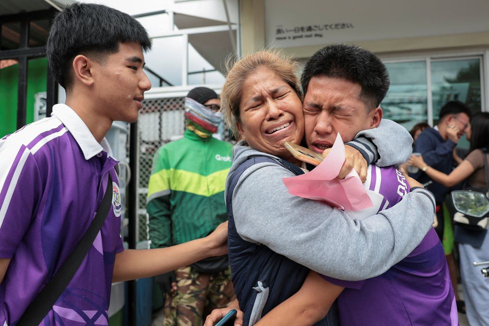 Students embraced by their loved ones