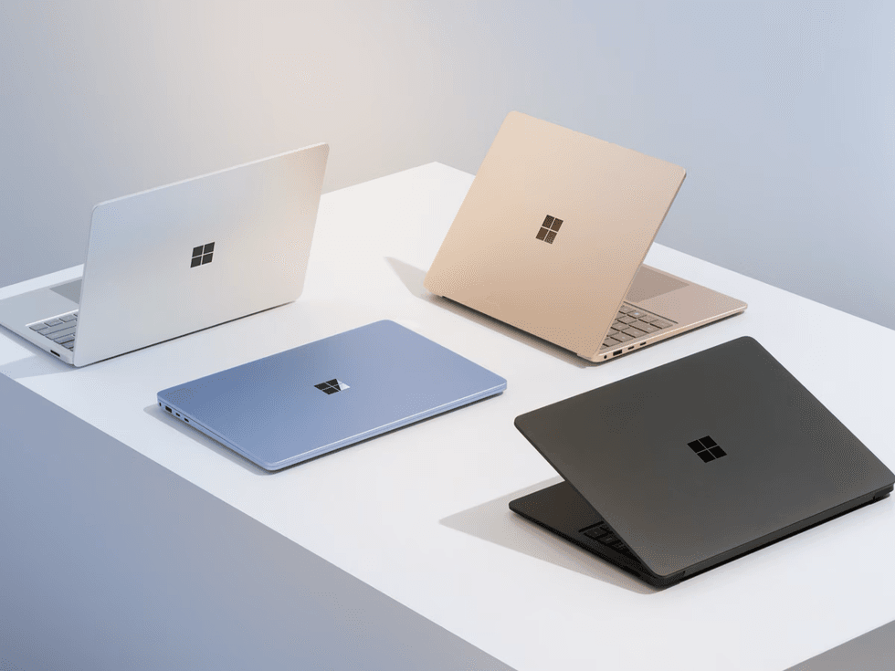 Surface Laptop 7th Edition pictured in all four colour options on a table