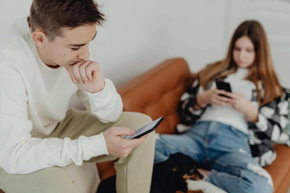 Teenagers using their phones