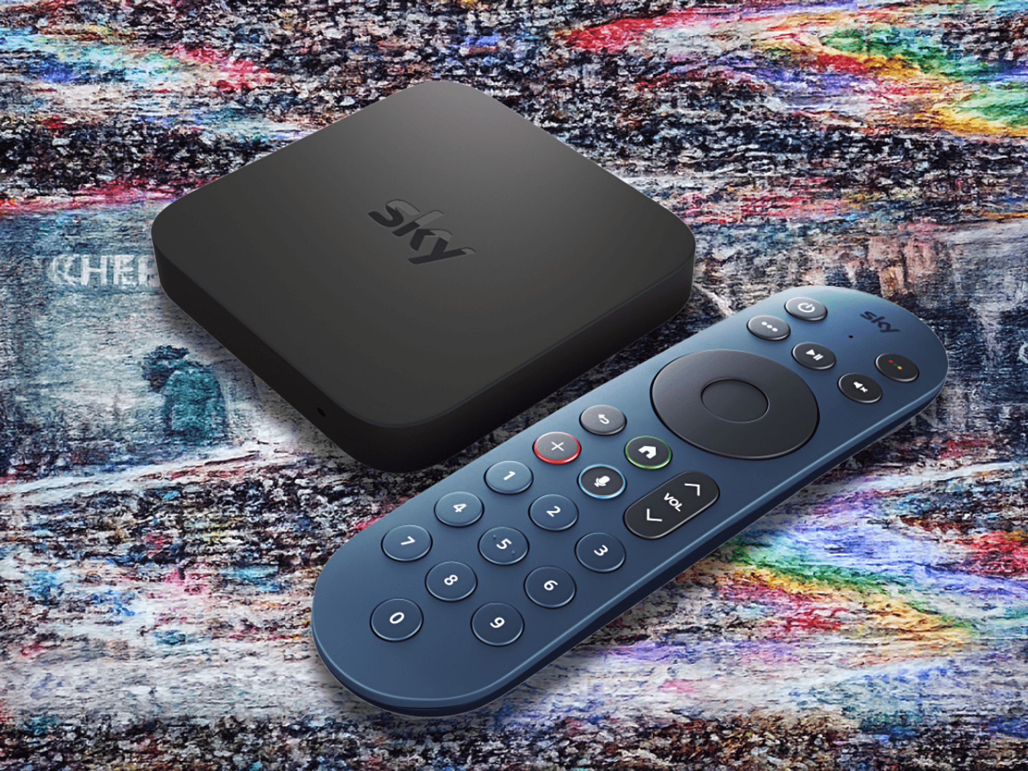 television static seen distorting Sky TV shows with a Sky Stream box and remote in the foreground