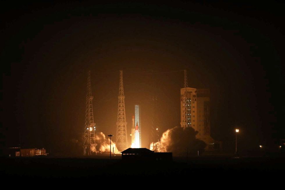 The "Simorgh" satellite carrier carrying three satellites is seen at an undisclosed location in Iran
