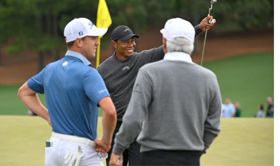 Tiger Woods celebrated his throw with Justin Thomas