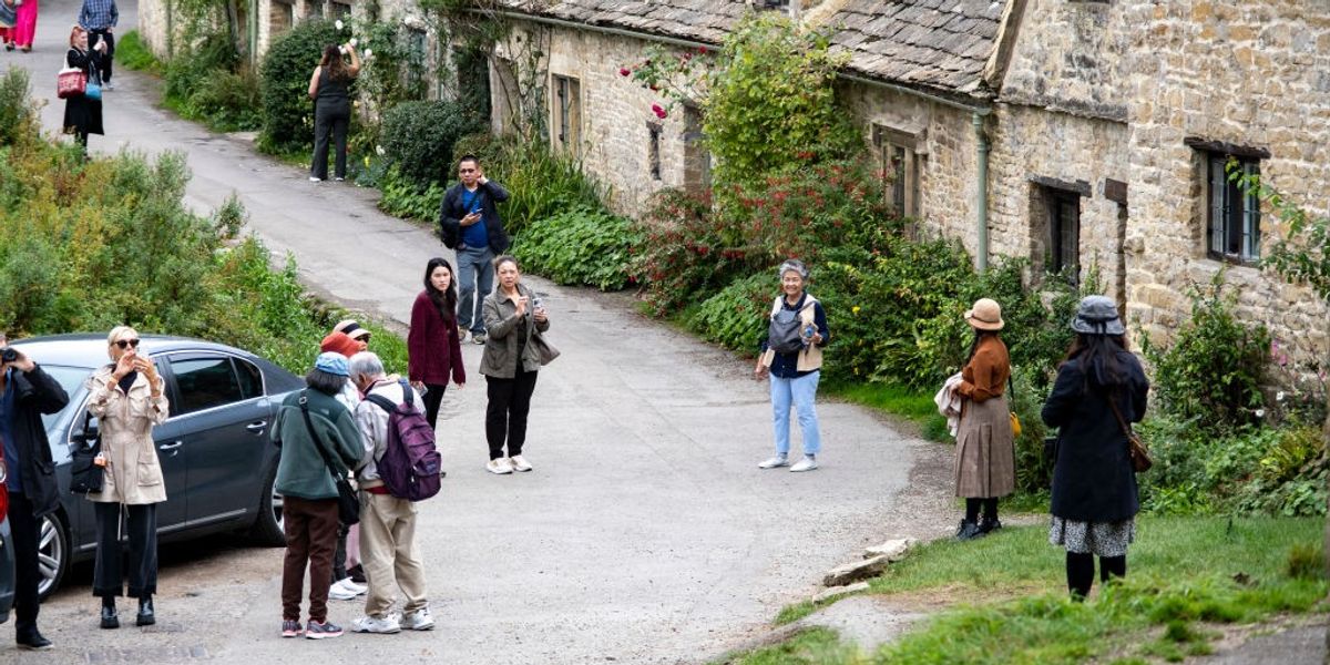 Parking row explodes after local's foot 'run over by car' as 'England’s prettiest village' overrun with tourists - 'Beyond a joke!'