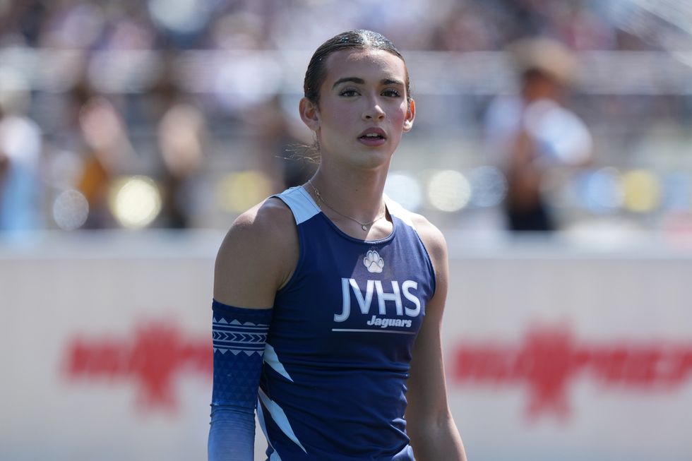 Trans athlete AB Hernandez capped a controversial high school athletics career by winning two state titles on a dramatic day that saw protests, political rallies and police presence outside the California track and field championships
