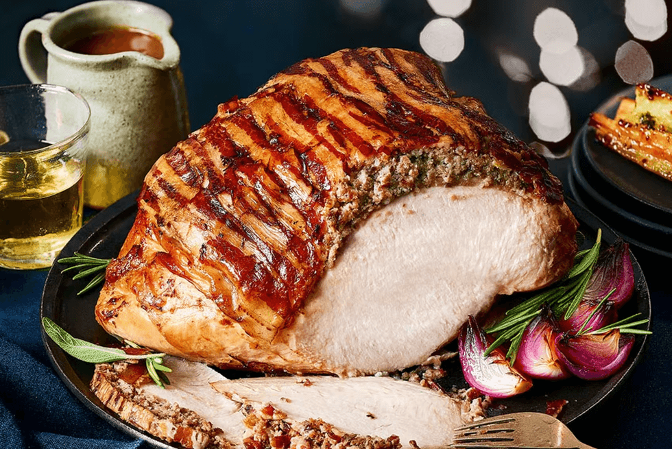 turkey crown from marks and spencer pictured on a plate with garlic and other trimmings