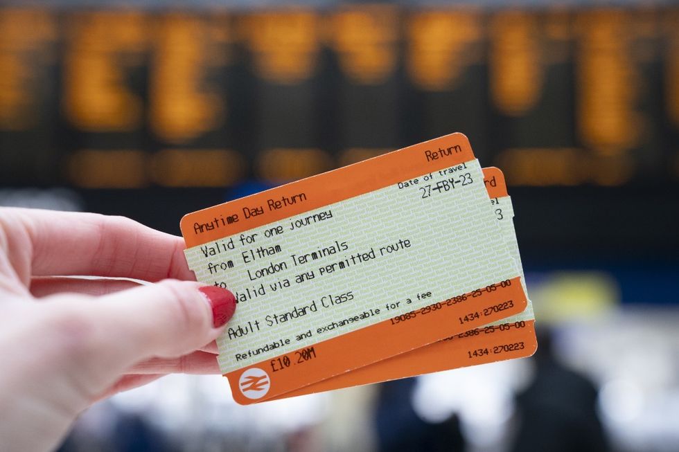 Two tickets being held at Waterloo station