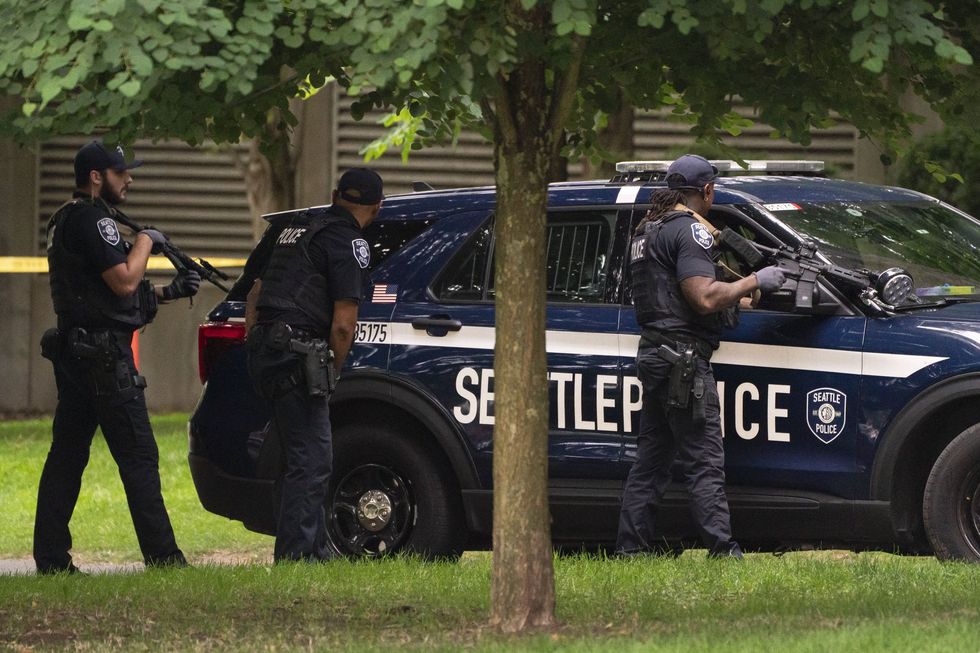 \u200bA police manhunt is underway following a shooting in Seattle
