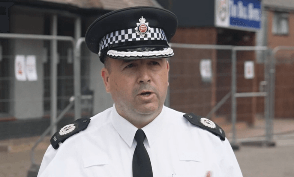 \u200bAssistant chief constable Stuart Hooper holds a press conference