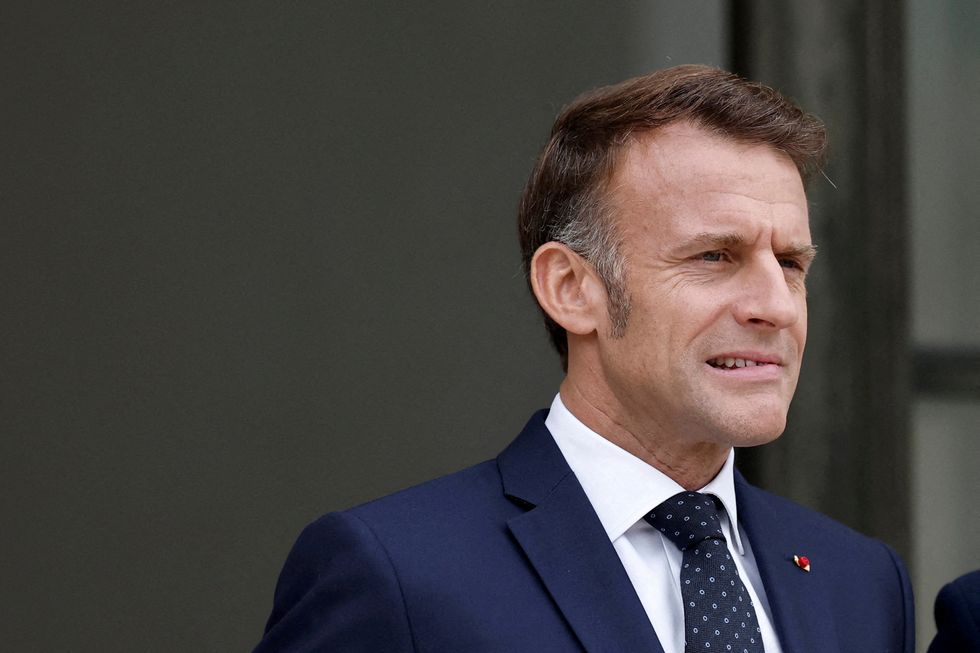 \u200bFrench President Emmanuel Macron reacts