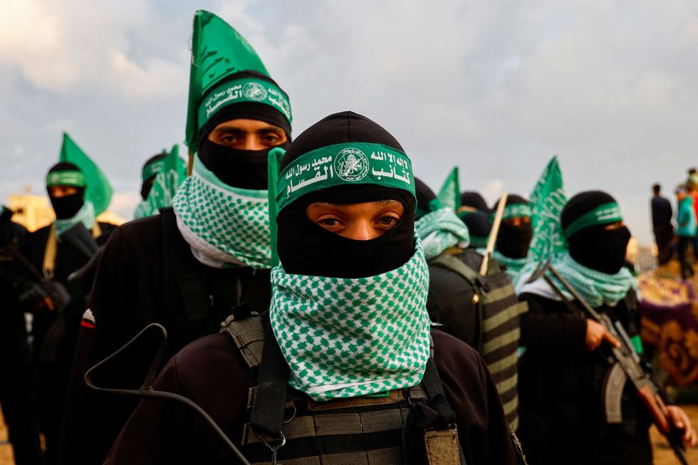 \u200bHamas militants keep guard on the day Hamas hands over deceased hostages