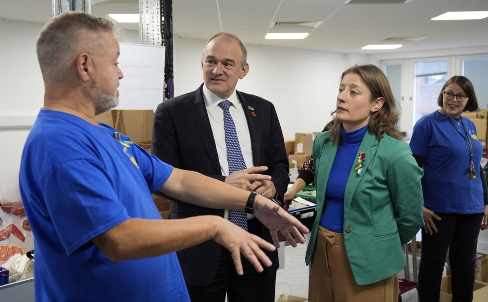 \u200bLiberal Democrat leader Sir Ed Davey (2nd left), with Epsom and Ewell MP Helen Maguire