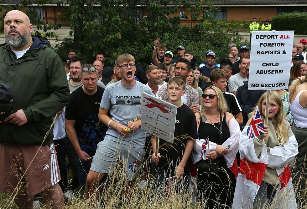 \u200bOne protester held up a sign reading: 'Deport all foreign rapists and child abusers'