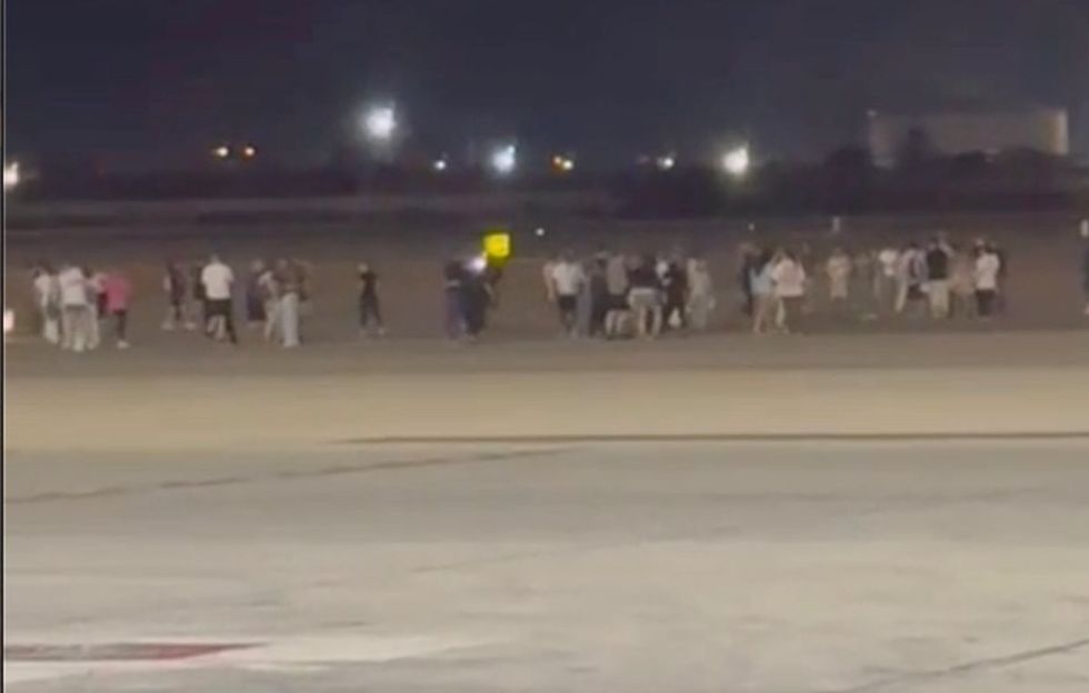 \u200bPassengers scrambled away, abandoning the plane