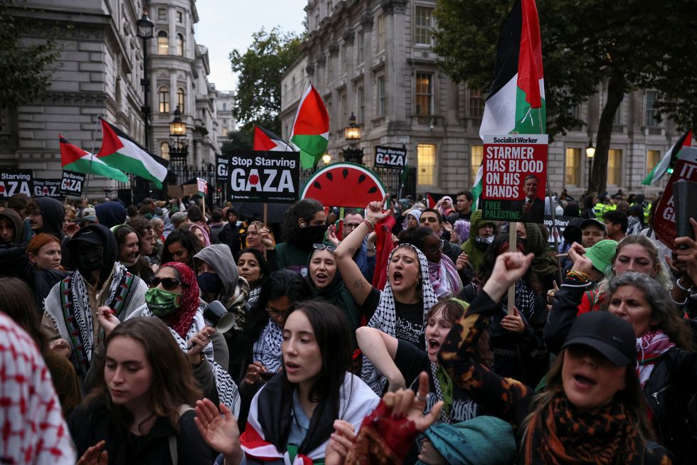 \u200bPeople chant as they gather in Parliament Square a
