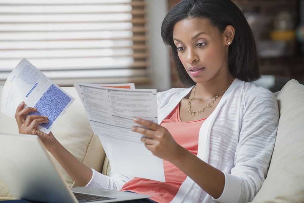 \u200bPerson looks worried at water bill statement