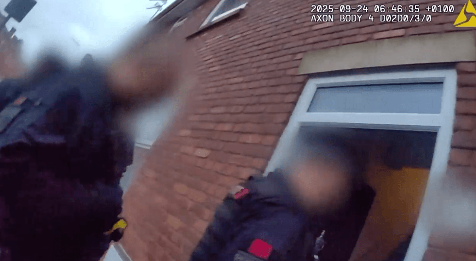 \u200bPolice entering a property in Oldham before making an arrest on Wednesday