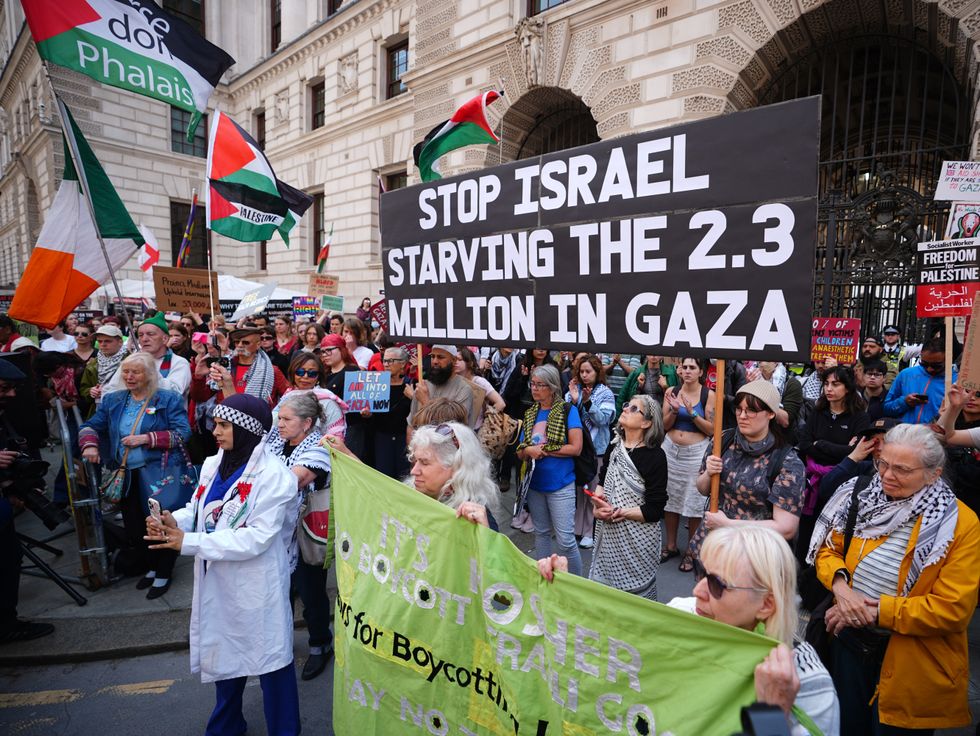 \u200bProtesters take part in a demonstration outside the