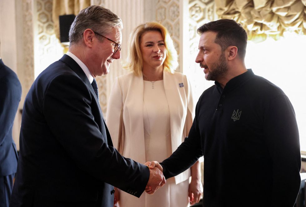 \u200bUkrainian President Zelensky shakes hands with Britain's Prime Minister Keir Starmer