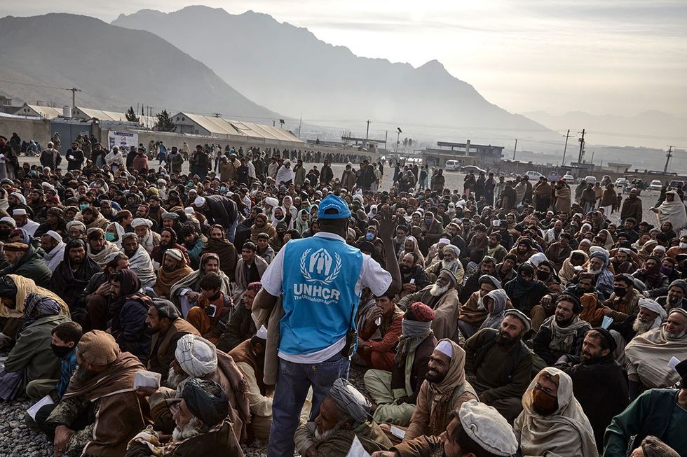 UN official with illegal migrants