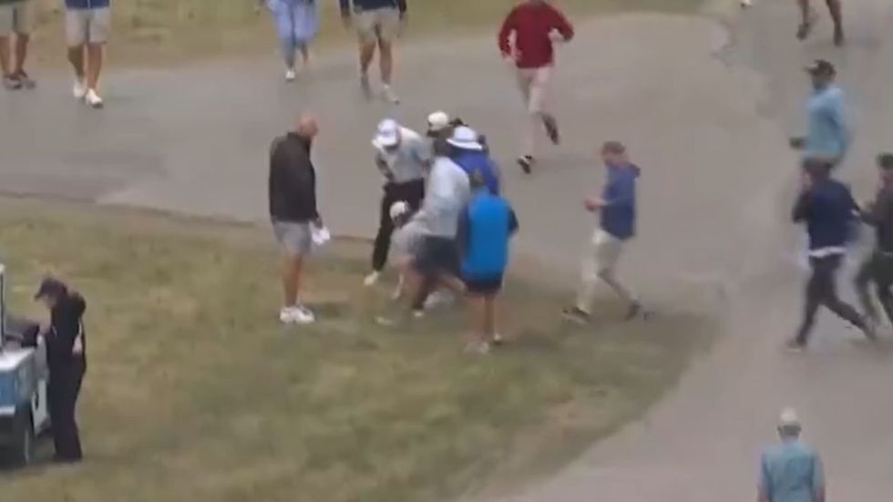 US Open organisers have been forced to clarify a bizarre incident involving Rory McIlroy after television viewers wrongly believed a spectator had picked up his ball during the opening round at Shinnecock Hills