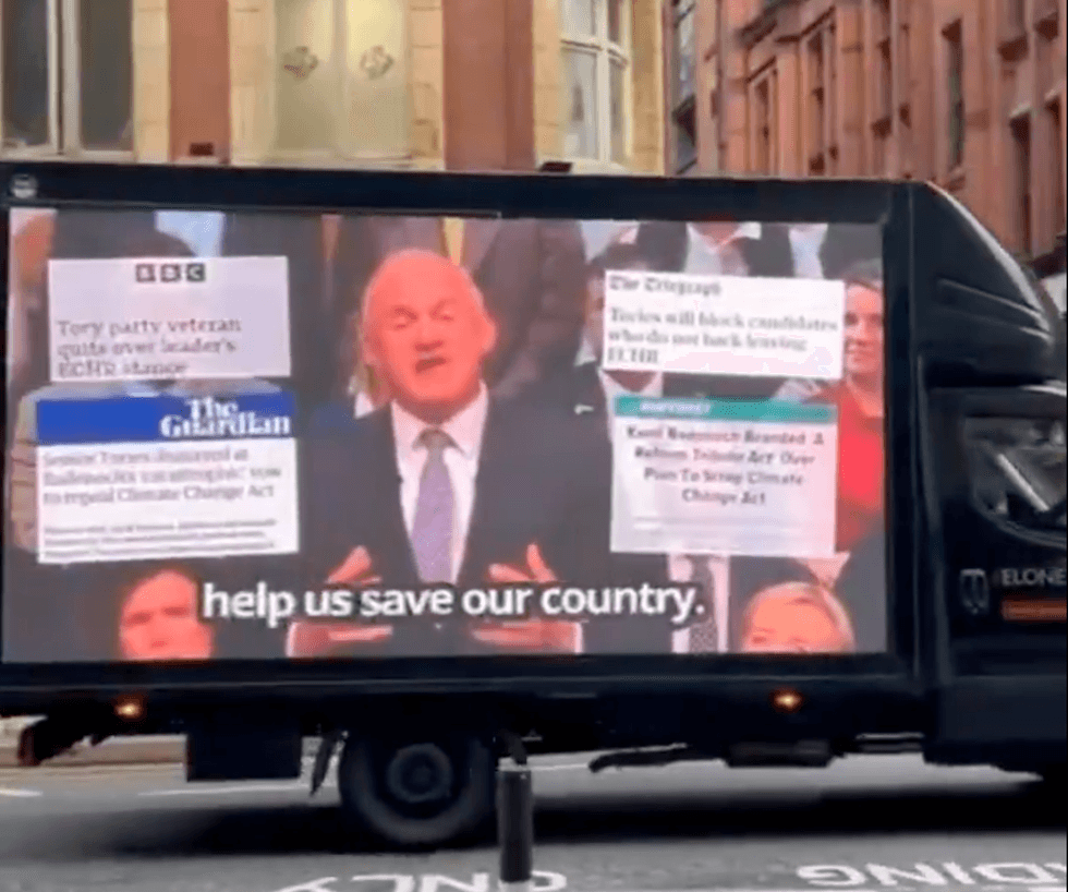 Van showing clip of Ed Davey speaking in Manchester