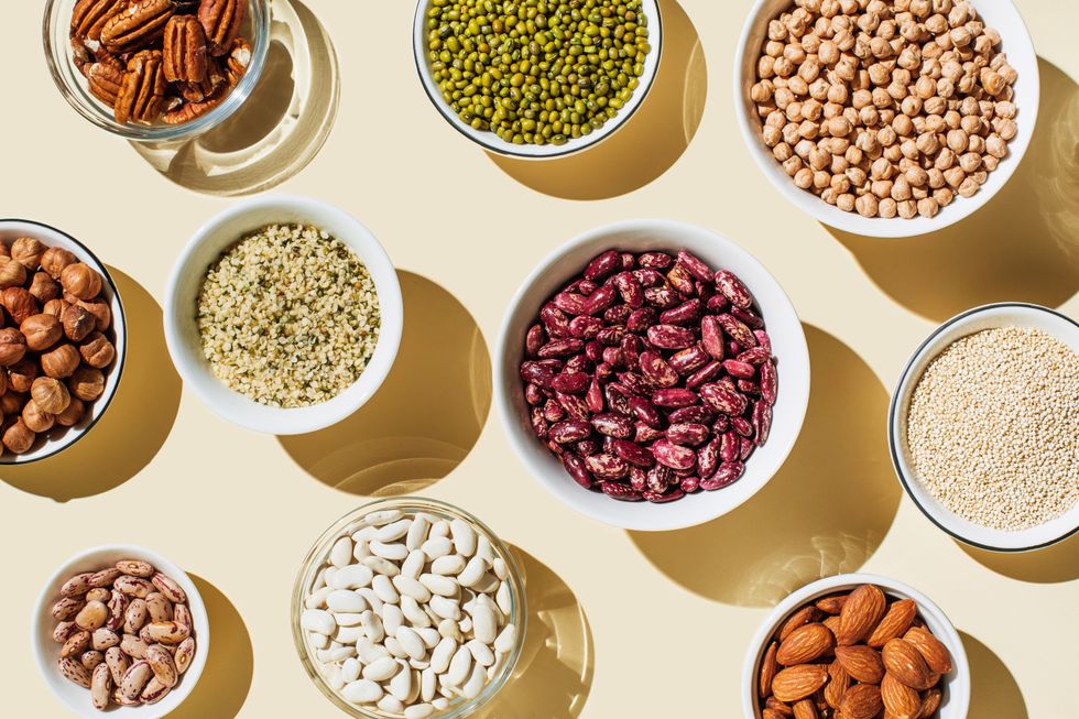 Various kinds of vegan protein sources on beige background