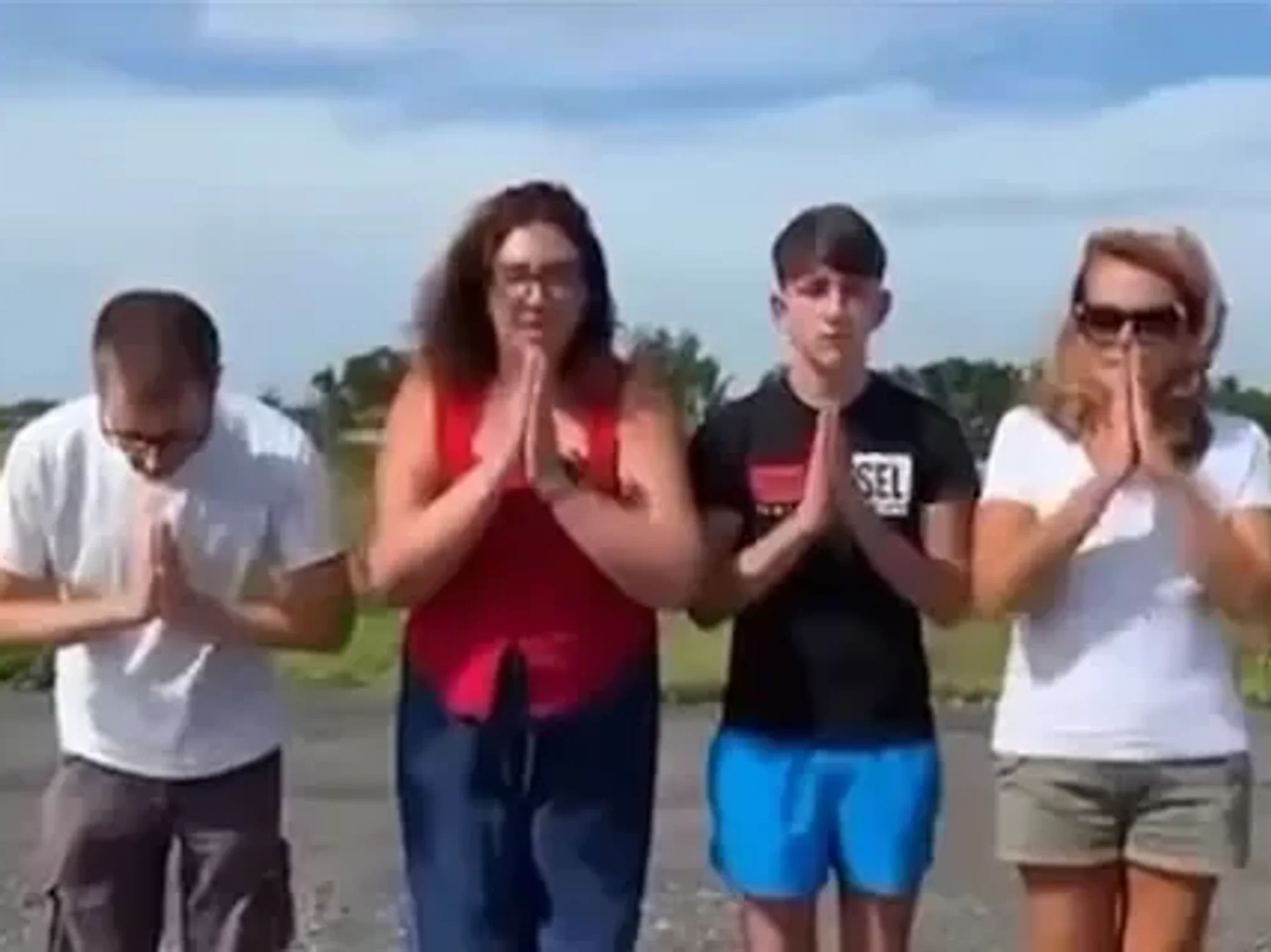 Video featuring three adults and one teenager from the group