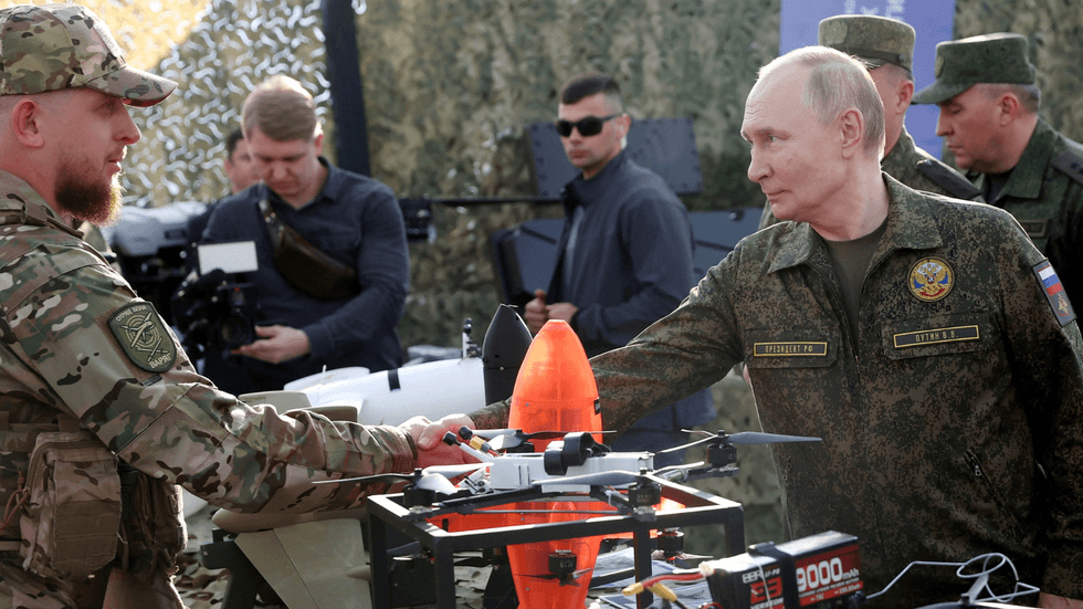 Vladimir Putin inspecting military equipment