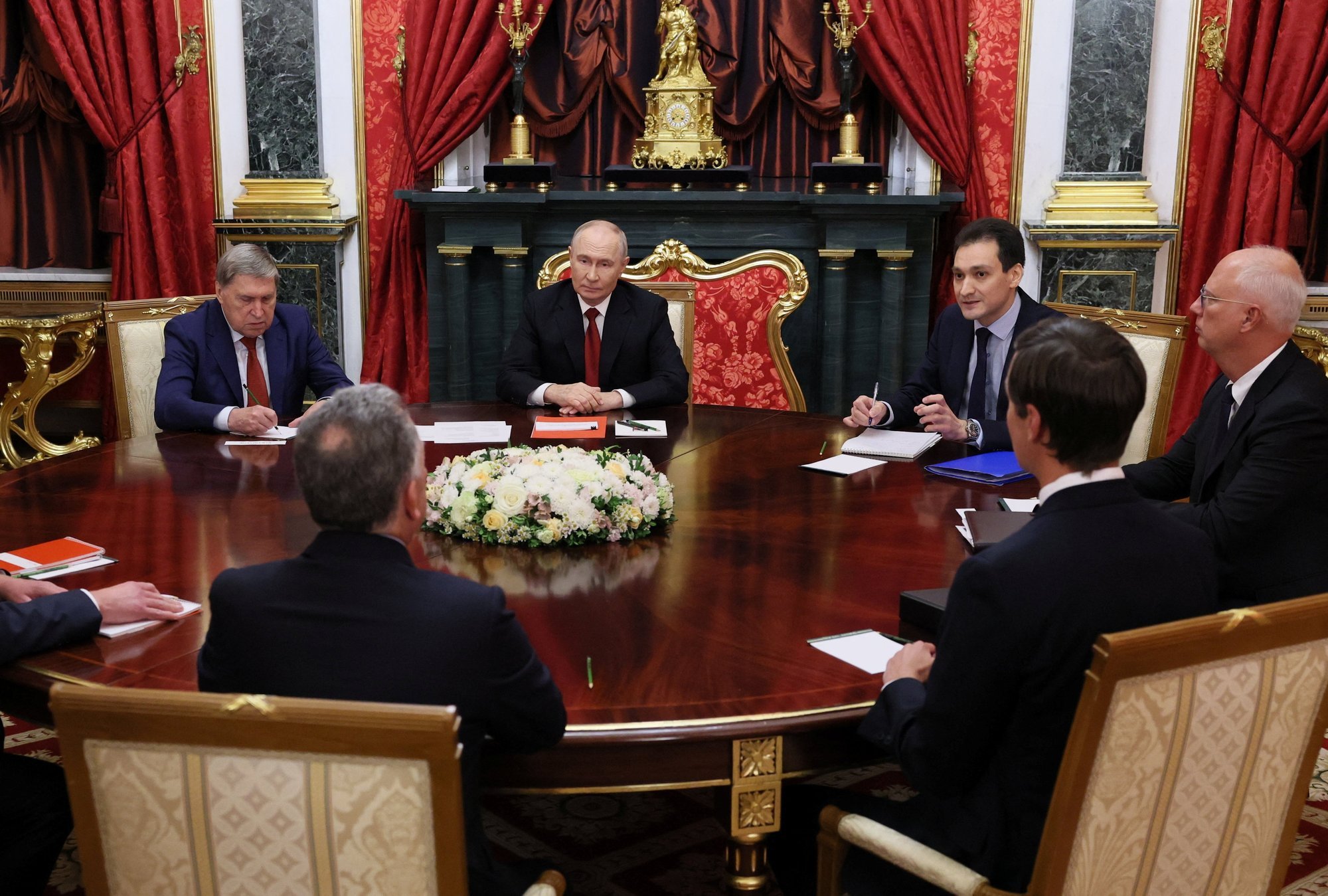 Vladimir Putin with team sits with US envoys Jared Kushner and Steve Witkoff