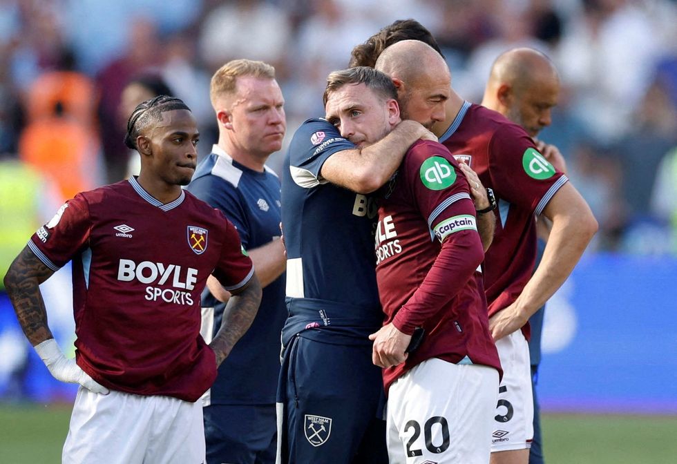 West Ham players look dejected following their relegation from the Premier League
