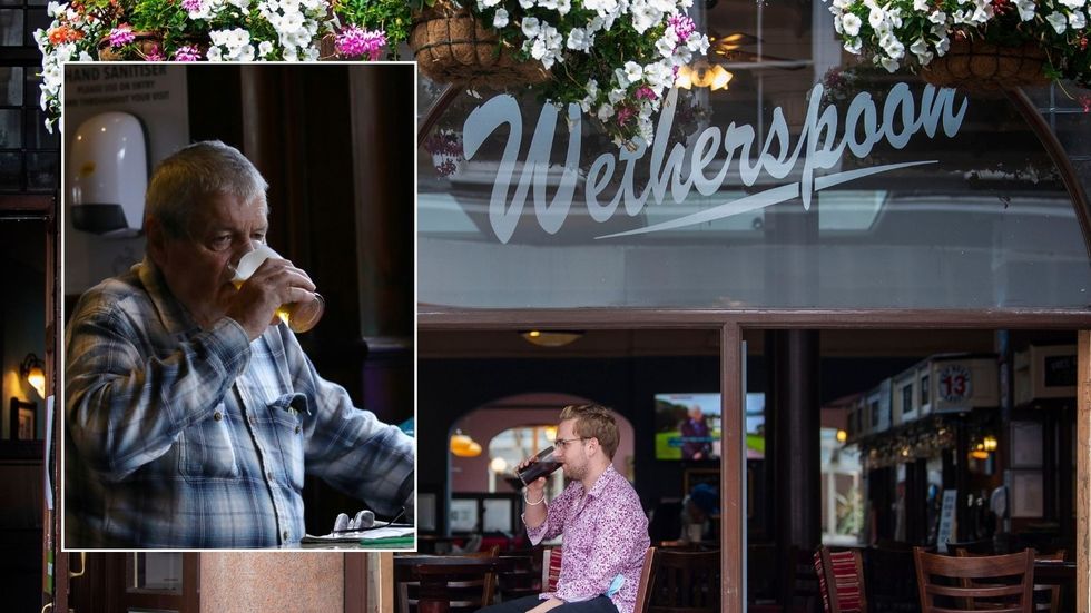 Wetherspoon and man having a pint