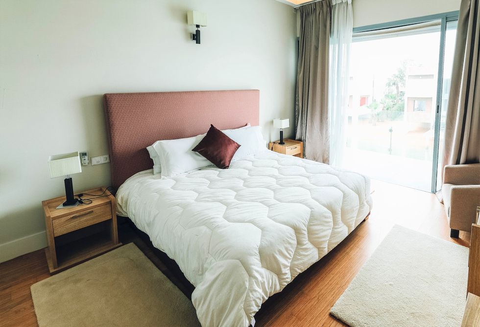 White bedding on bed in bedroom