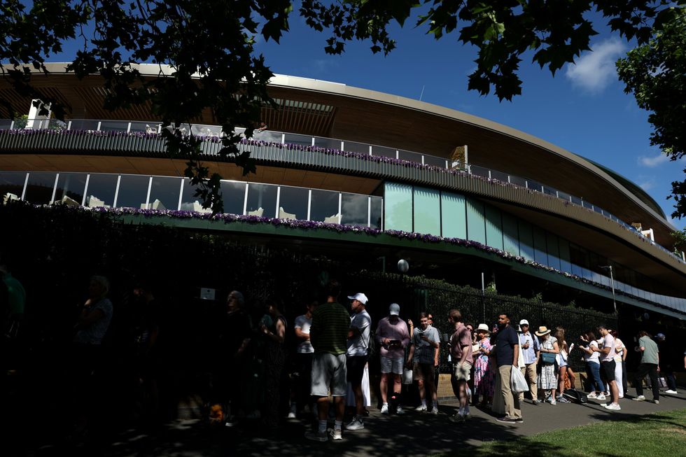Wimbledon chiefs have urged fans not to travel to the famous queue after huge crowds descended on the All England Club on the opening morning of the Championships