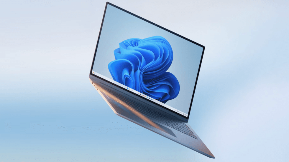 Windows 11 laptop pictured on a light blue background