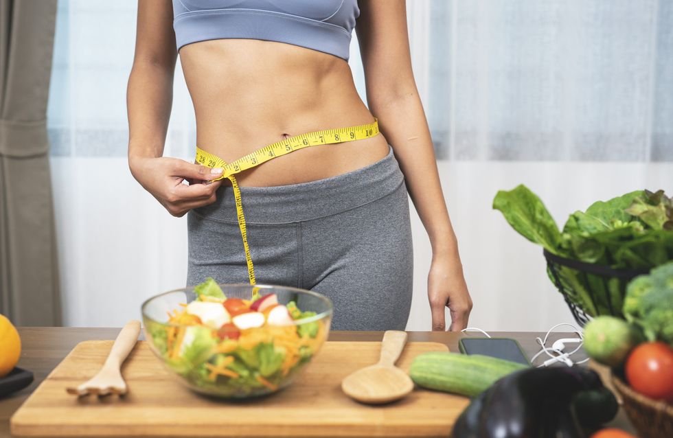 Woman abs in kitchen