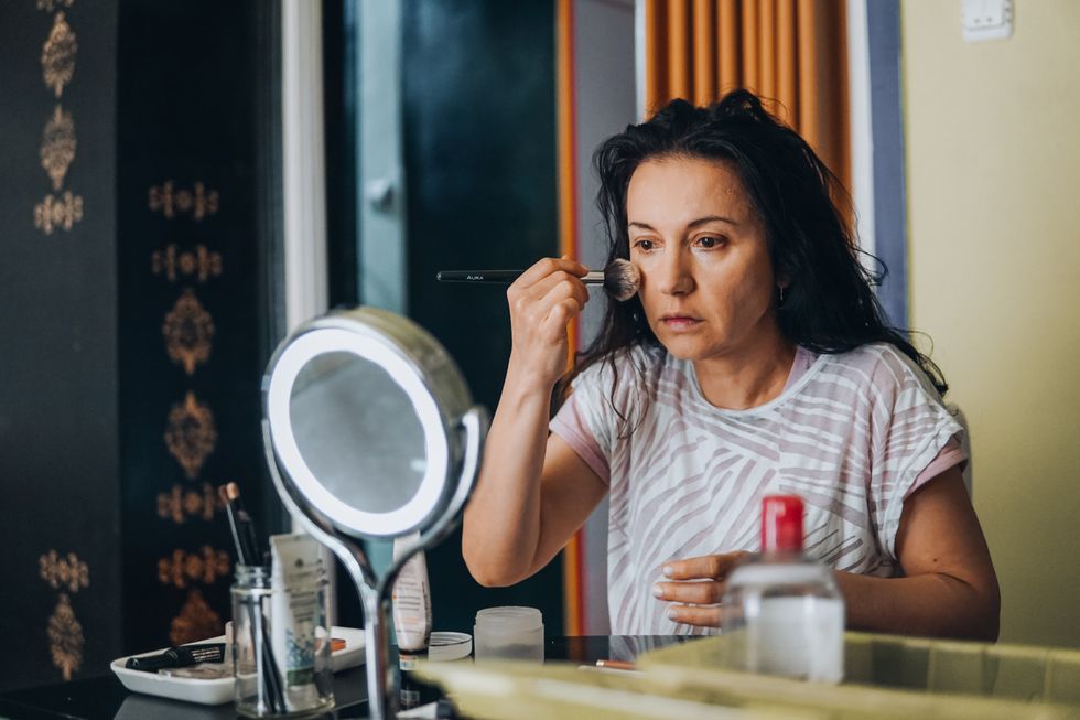 Woman applying foundation