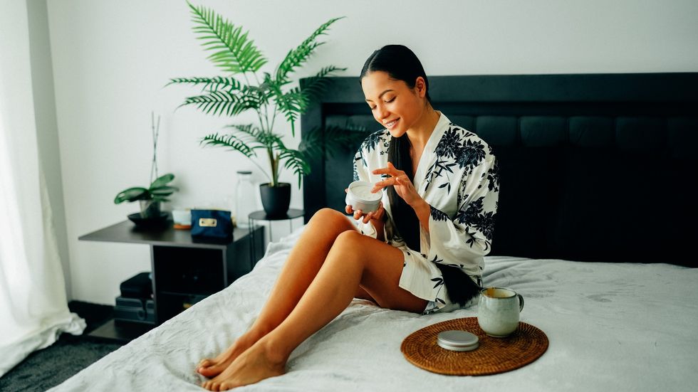 Woman applying shea butter