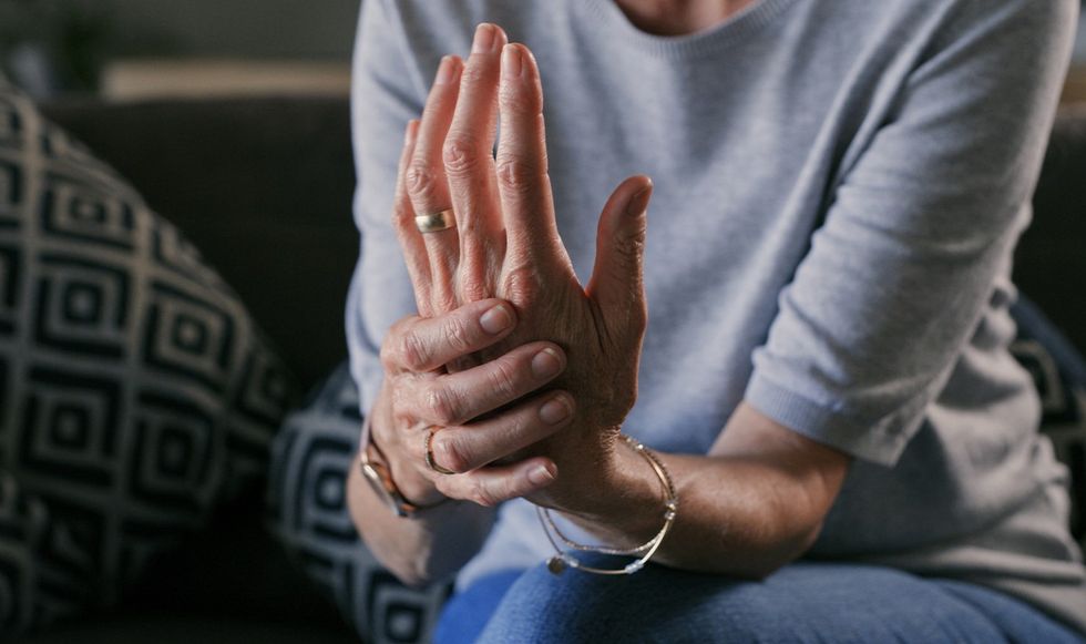 Woman clenching hand