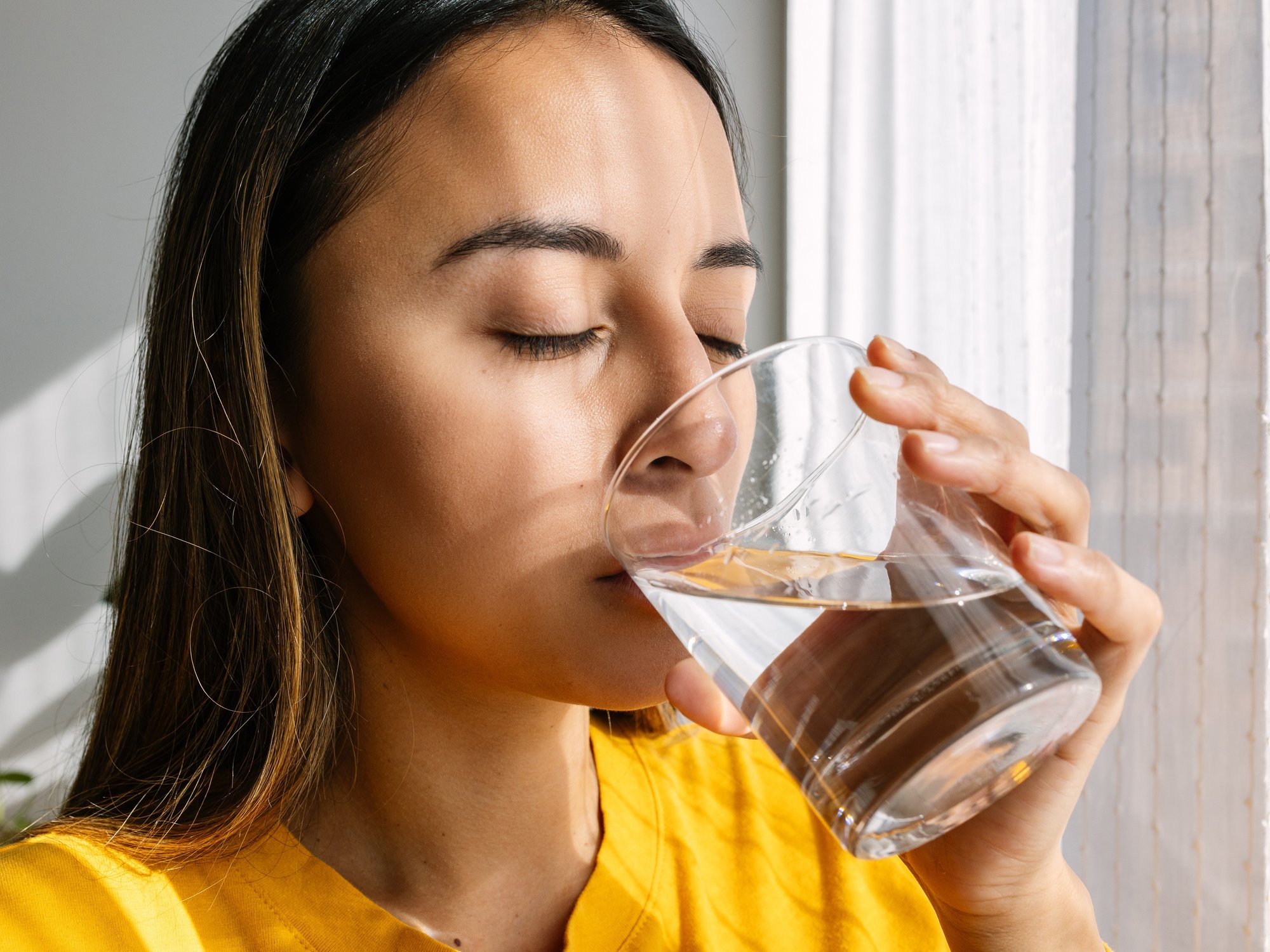 Woman drinking a glass of water