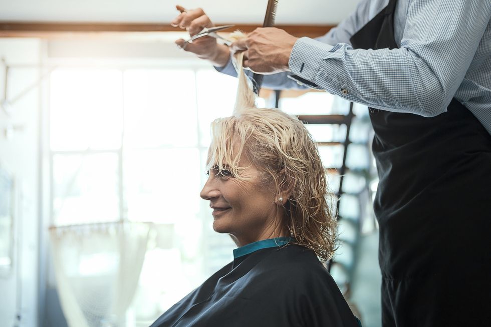 Woman having her hair cut