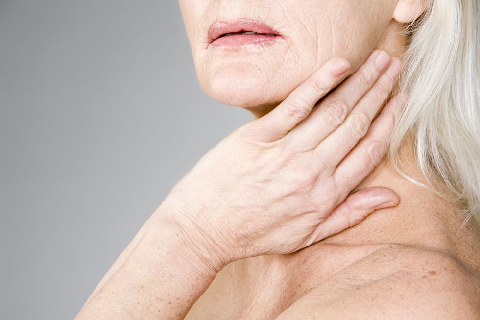 Woman holding neck
